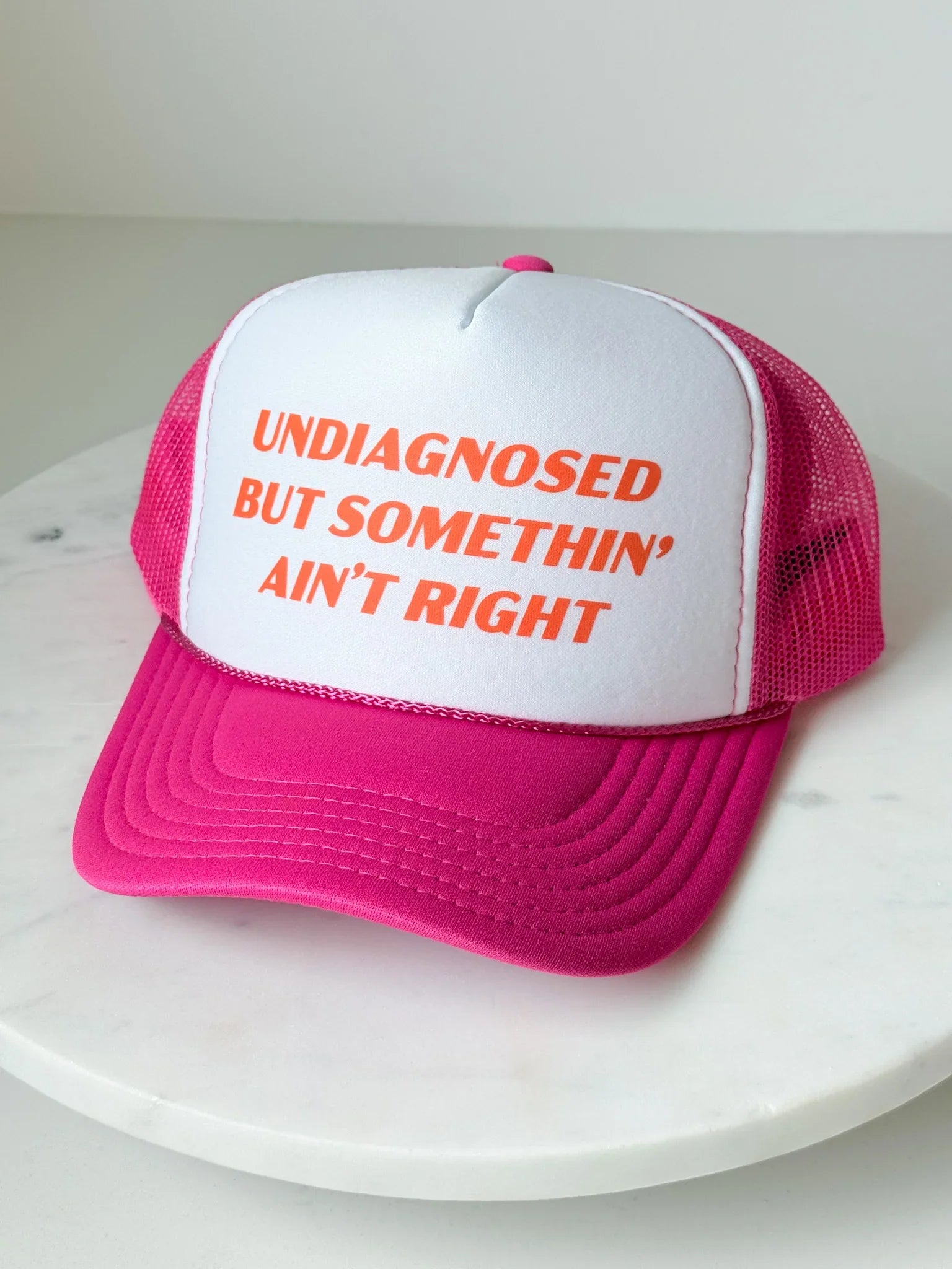 Somethin’ Ain’t Right Trucker Hat