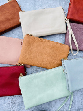 Crossbody Mini clutch purse in an array of colors.  Can be found at Vintage Soul in Dripping Springs, TX